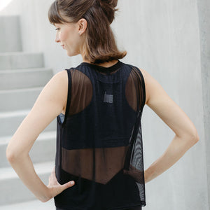 Black mesh cropped maternity activewear and postpartum tank from the back