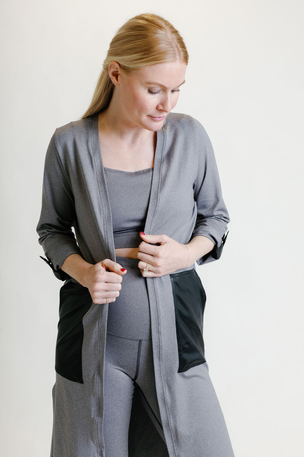 Grey maternity activewear and postpartum duster with adjustable sleeve clips