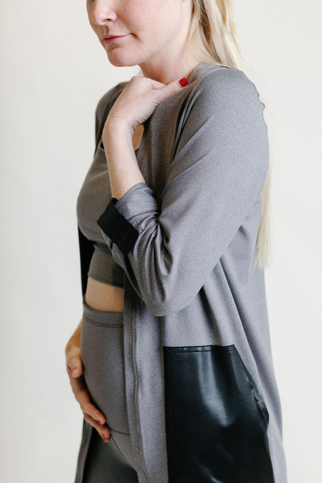 Grey maternity activewear and postpartum duster with adjustable sleeve clips