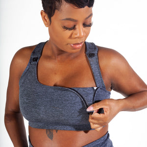 Grey colored maternity activewear nursing sports bra with mesh-back design and an adjustable band with hooks.