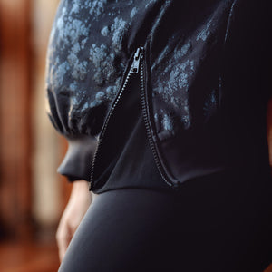 Stylish black maternity activewear and postpartum top with mesh sleeves 
