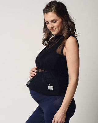 Black mesh cropped maternity activewear and postpartum tank from the side